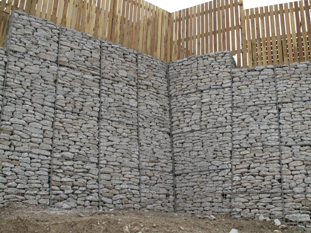 Stone wall with wooden fence (close up)