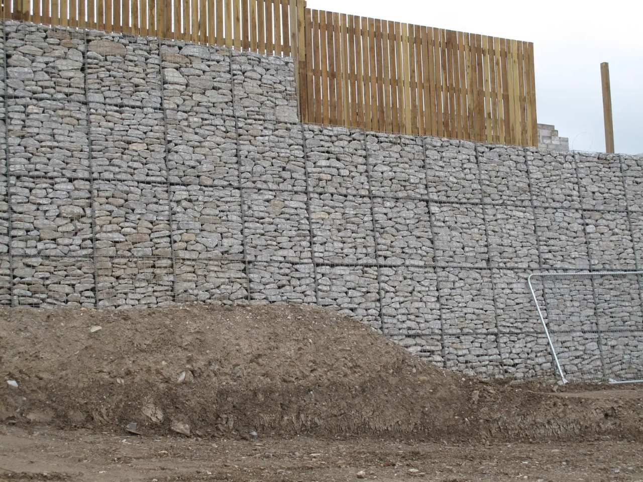 Stone wall with wooden fence